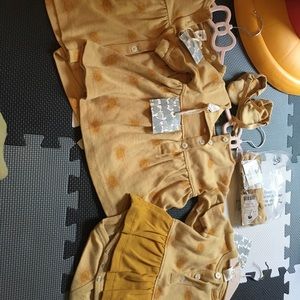 Three Kate Quinn sunburst outfits. Size 3-6 months new with tags. Bow, etc.